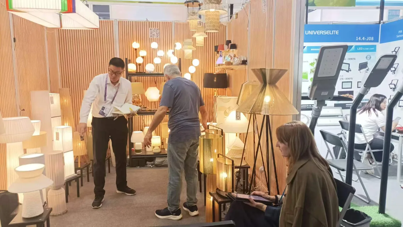 A conversation beside Delta’s lighting display at the April 2026 Canton Fair