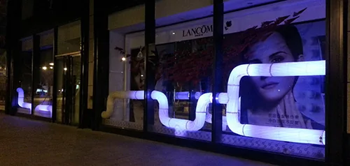 Sculptural lighting along the frontage.